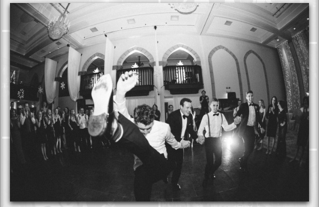 men dancing at wedding